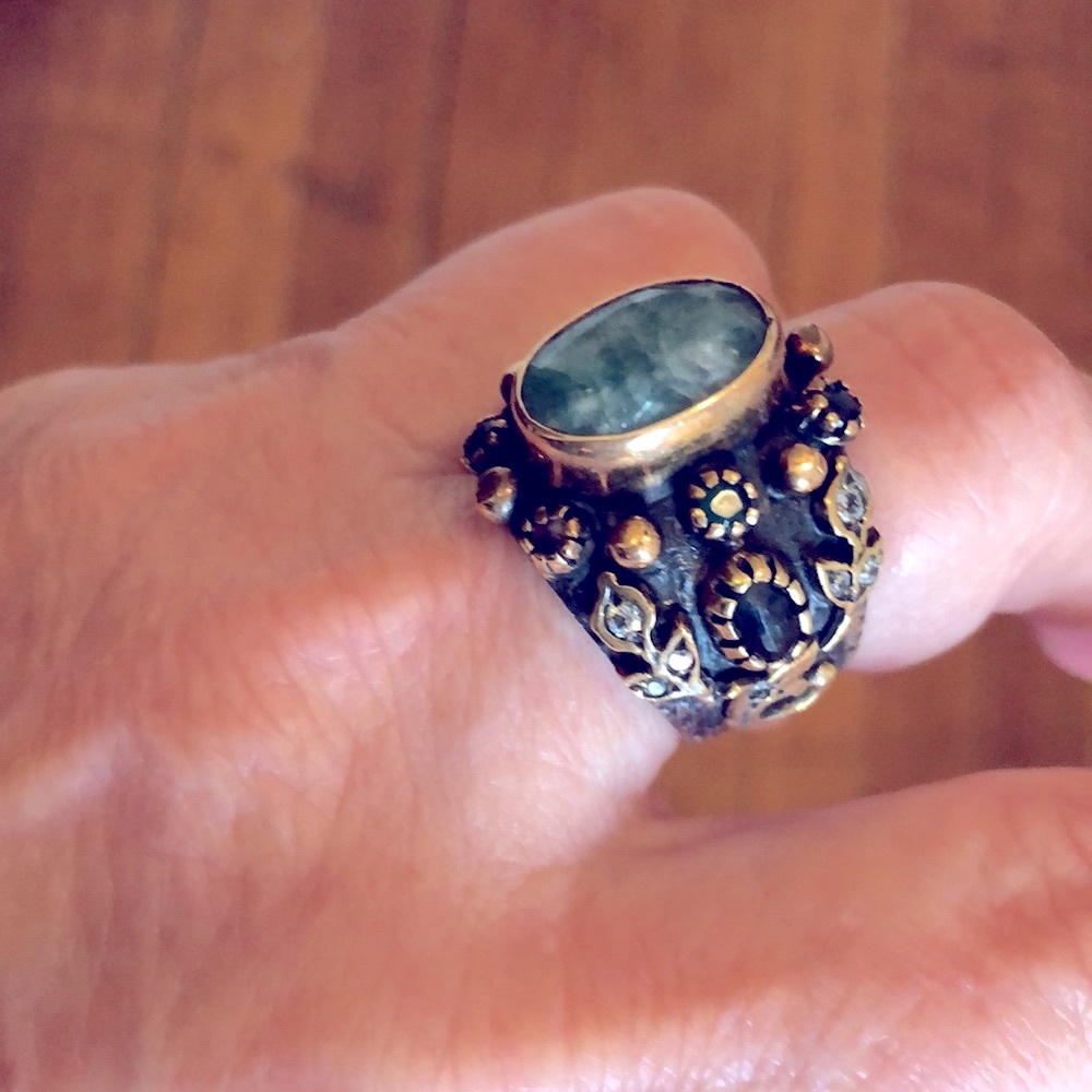 Black Silver Ring with center green stone, exquisitely set small stones